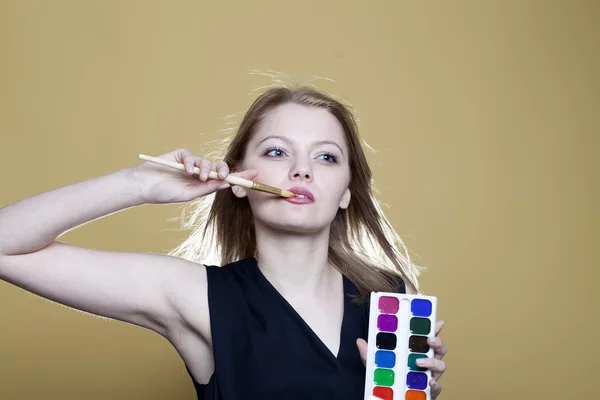 Woman with paint and brush — Stock Photo, Image