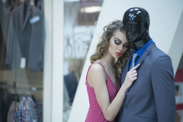 Misterious girl and mannequin — Stock Photo, Image