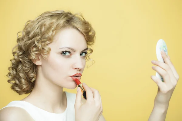 Woman in a white dress rouges — Stock Photo, Image