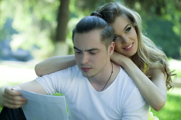 Student boy with girl in park — Stock Photo, Image