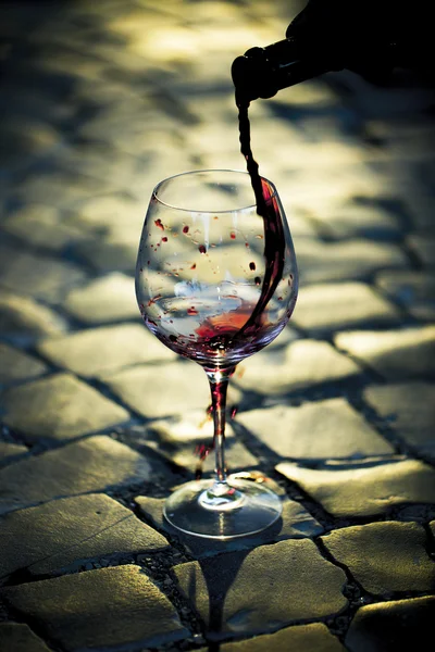 Red wine poured in bocal — Stock Photo, Image