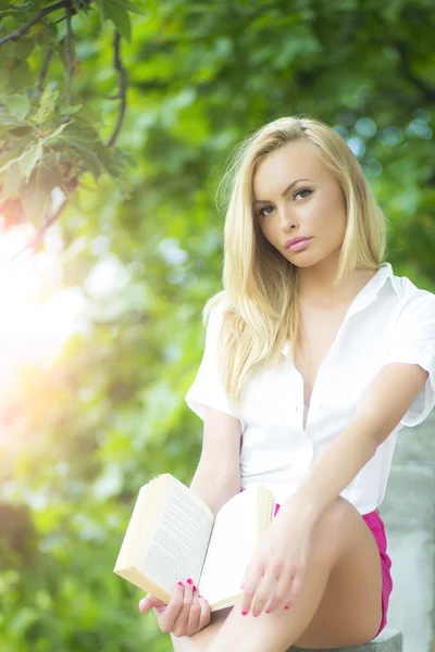 Sweet woman with book — Stockfoto