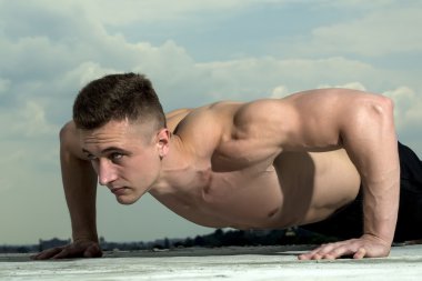 Handsome male bodybuilder training