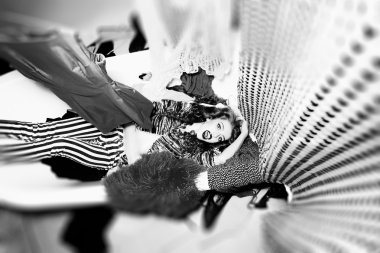 Striking girl in bath with clothes