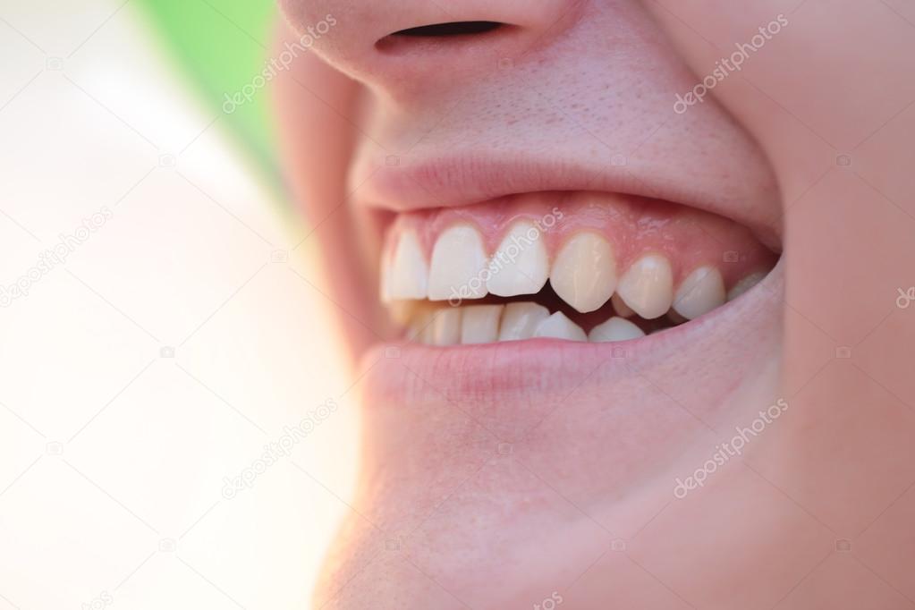 Female open mouth smile closeup