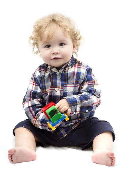 Pequeño niño jugando con juguete colorido —  Fotos de Stock