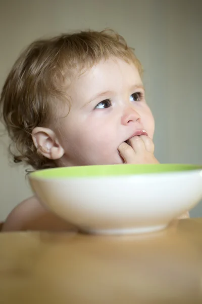 Portrait of curious boy eating — Stock Photo, Image