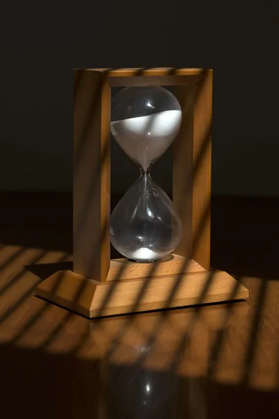 Wooden sand glass on table