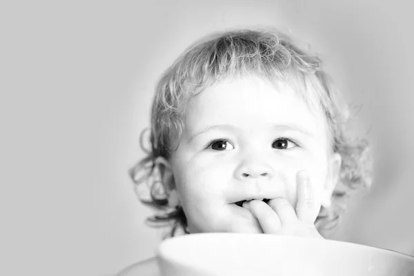 Portrait of small baby boy eating — Stock Photo, Image