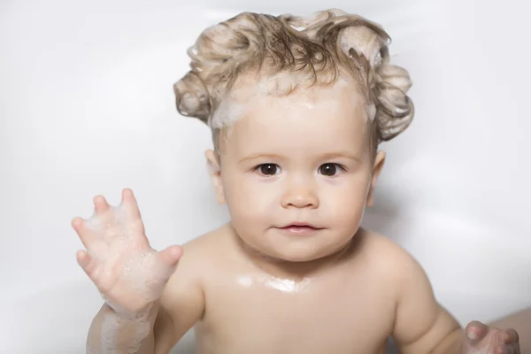 Adorable little boy with foam in bath — Stock Photo, Image
