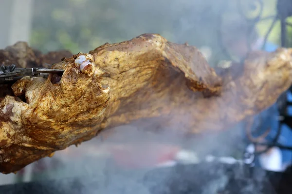 Juicy meat roasted on spit grille — Stock Photo, Image