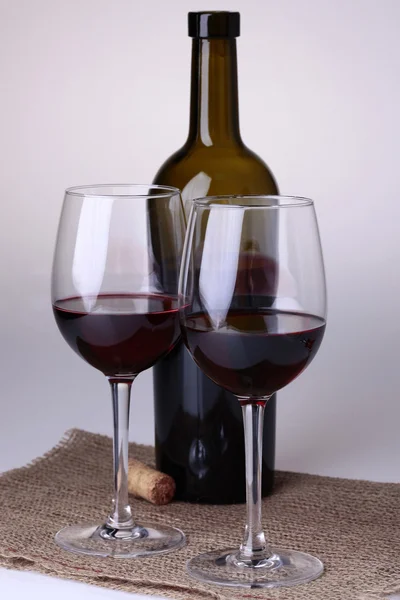 Bottle two glasses cork and burlap — Stock Photo, Image