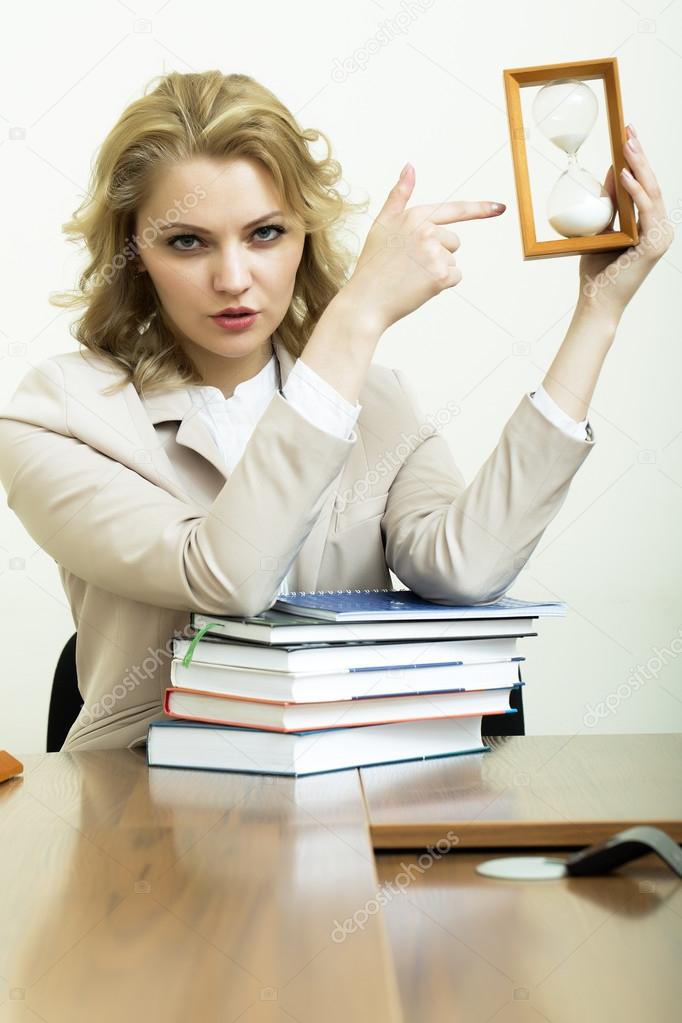 Business woman with books and glass