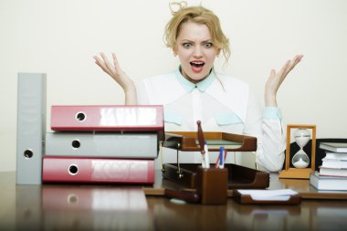 Crazy woman at office table