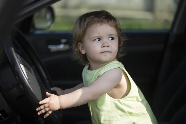 Curious little driver in car — Stok fotoğraf
