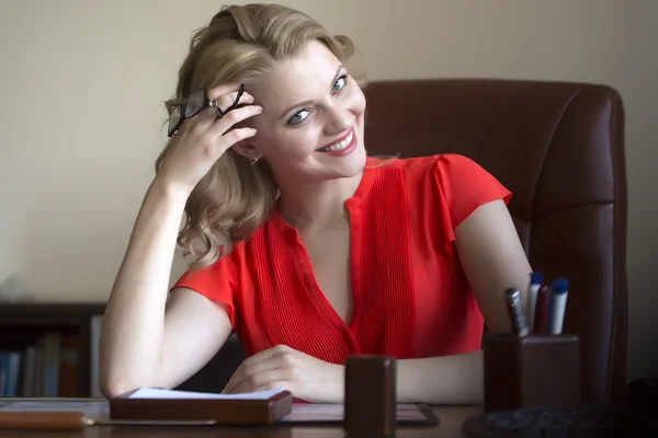 Pretty business woman in chair