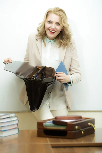 Laughing business woman with briefcase — Zdjęcie stockowe