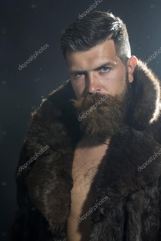 Sullen man in fur coat Stock Photo by ©Tverdohlib.com 79654174