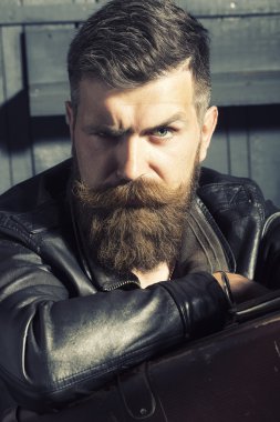 Portrait of sullen man with briefcase