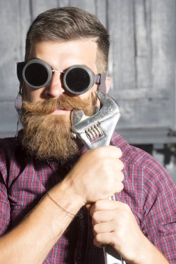 Man with spanner in glasses