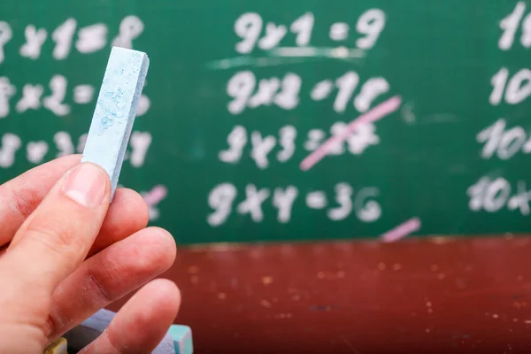 Human hand and blackboard — Stock fotografie