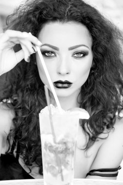 Brunette woman with mojito