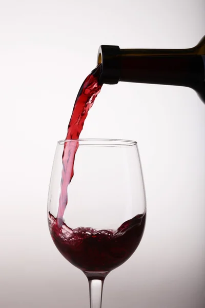 Pouring wine from bottle Royalty Free Stock Photos