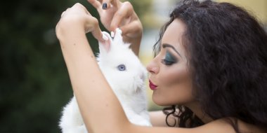 Brunette woman with rabbit