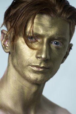 Closeup of golden man