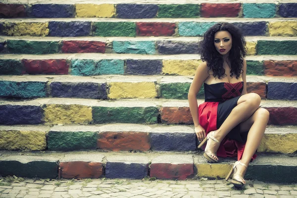 Young woman on stairs — Stock Photo, Image