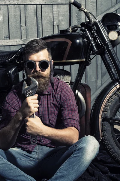 Man with wrench in glasses — Stock fotografie