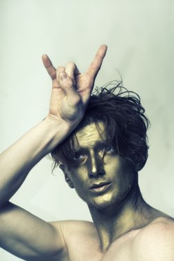 Gold man with cool gesture