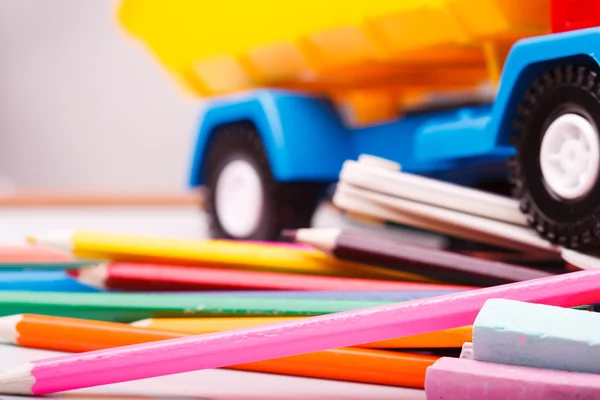Colorful school stationary and car