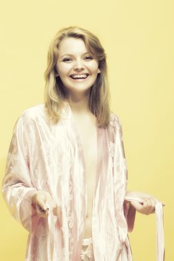 Smiling lady in dressing gown