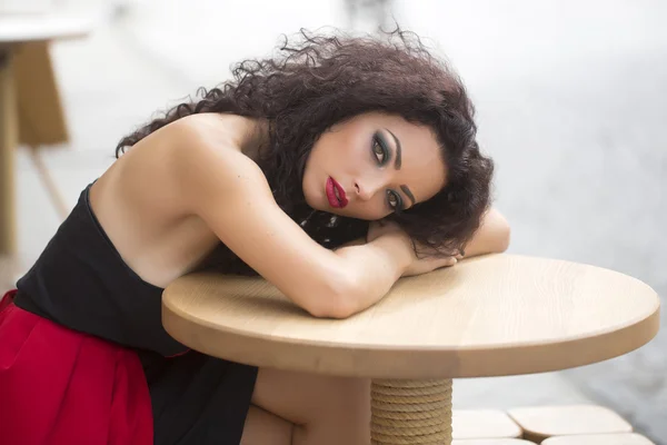 Portrait of sexy woman siting at table — Stock Photo, Image