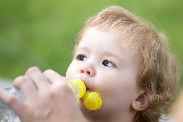 Baby boy drinking water — Stock Photo, Image