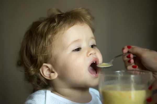 Cute child boy eating soup — Stock Photo, Image