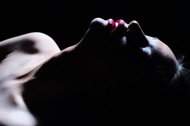 Portrait of woman in shadow