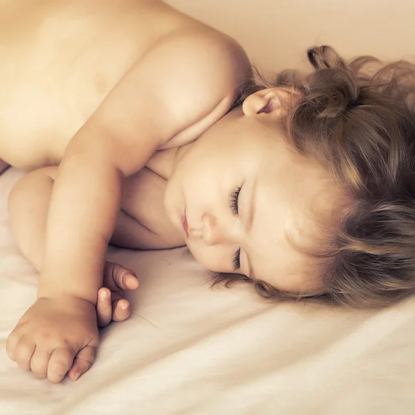 Sleeping baby in bed — Stock Photo, Image