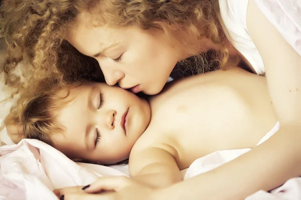 Mother kissing baby — Stock Photo, Image