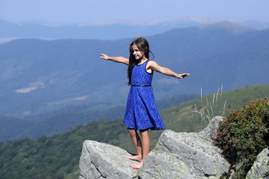 Small girl in mountains clipart