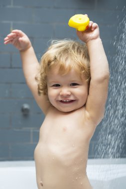 Happy boy in shower clipart
