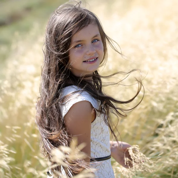 Girl in spikelet — Stock Photo, Image