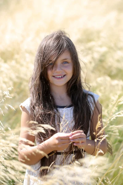 Girl in spikelet — Stock Photo, Image