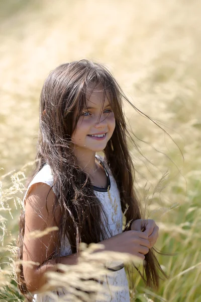 Girl in spikelet — Stock Photo, Image