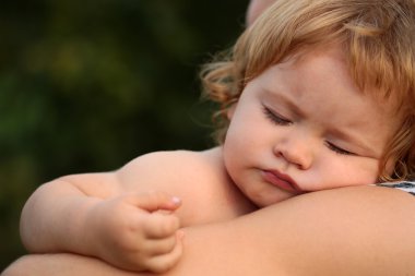 Sleeping boy on hands