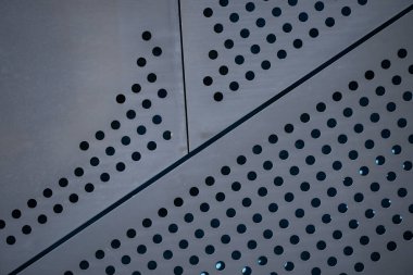 Endüstriyel tasarım için Grunge metal dokusu. İnşaatta delinmiş metal deseni. Metalik görünümlü ağır çelik desenli. Perçinlenmiş çelik levhalarla endüstriyel arka plan