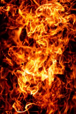 Yanan parıltılı alev dokusu. Karanlık arka planda alev kıvılcımları. Alev soyut ateş etkisi. Alev kaplama ögesi