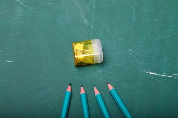 Four pencils and sharpener — Stok fotoğraf