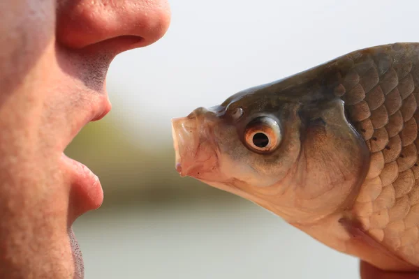 Human and fish head